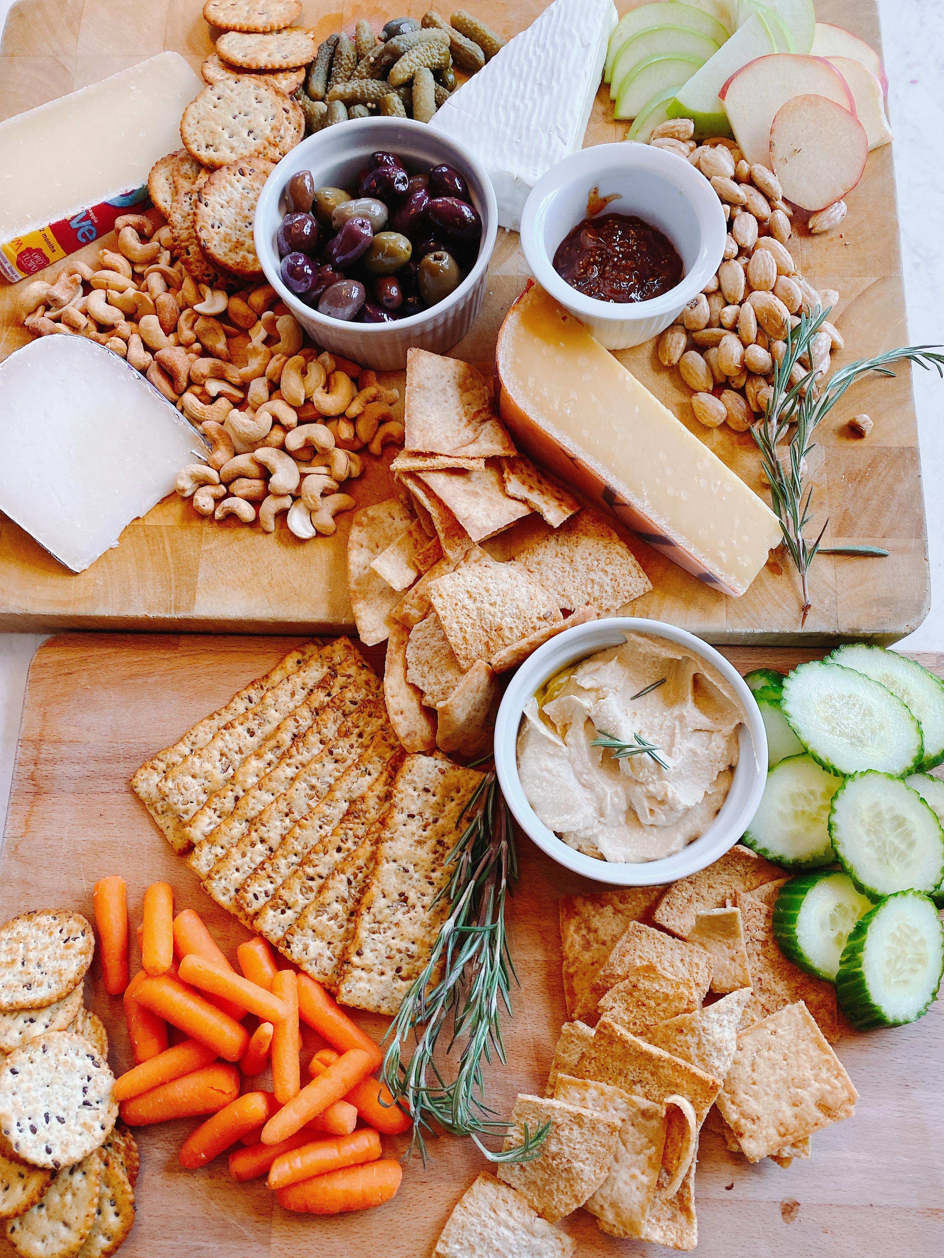 Charcuterie board styled with cheeses and fruit